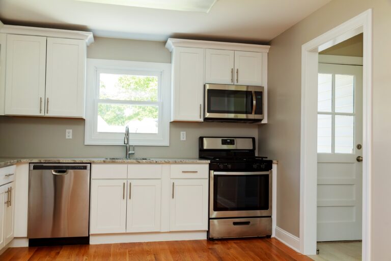 Gourmet kitchen with white Shaker cabinets