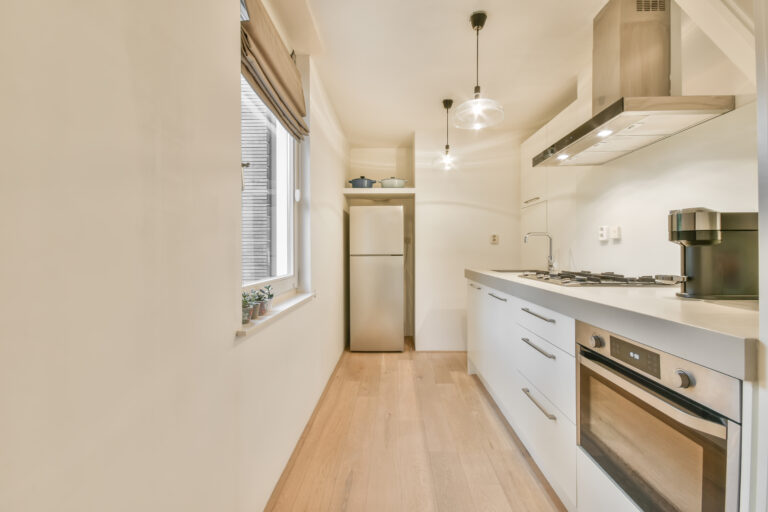 Spacious luxury kitchen with flat-panel cabinets