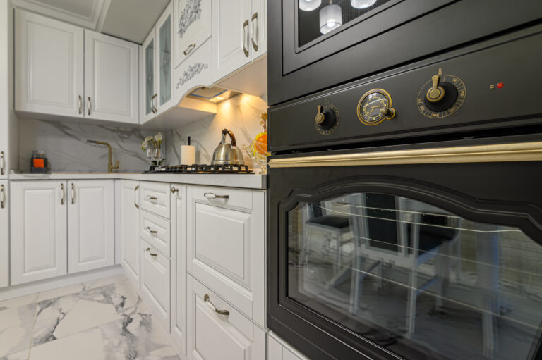 Classic white kitchen with a glass-front upper cabinet